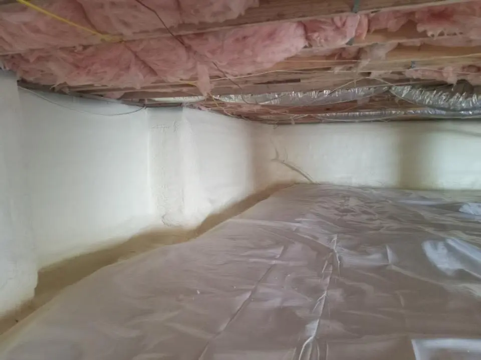 Crawl space encapsulation with closed-cell spray foam for Commercial Roof Restoration in Minooka
